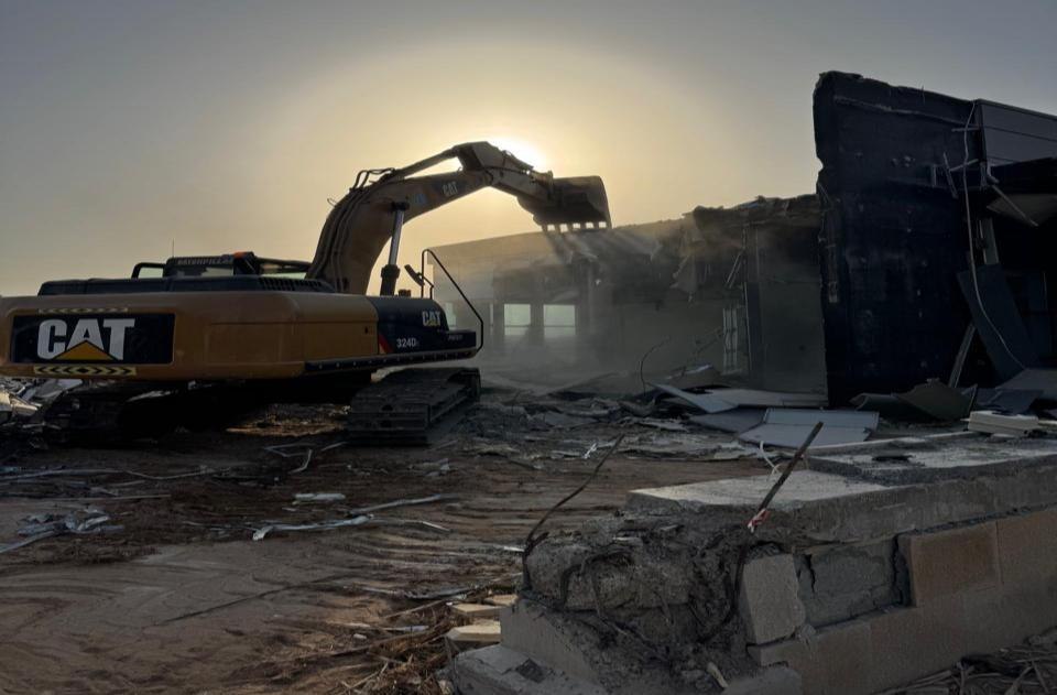 Excavator operating on a demolition site