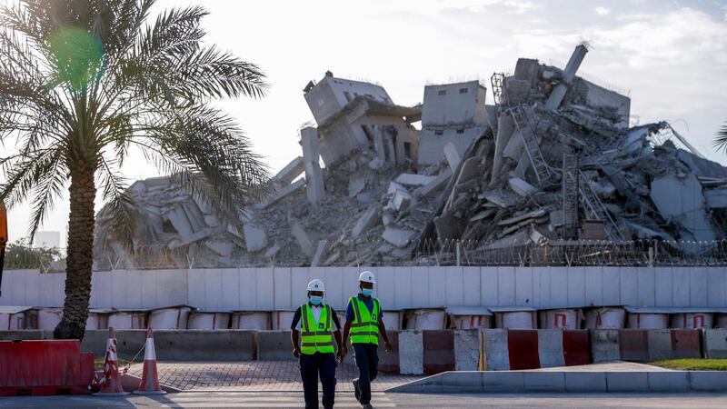 Site personnel in front of the Mina Plaza demolition works